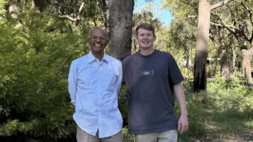 Professor Nanthi Bolan stands beside Soil CRC PhD student James O'Connor