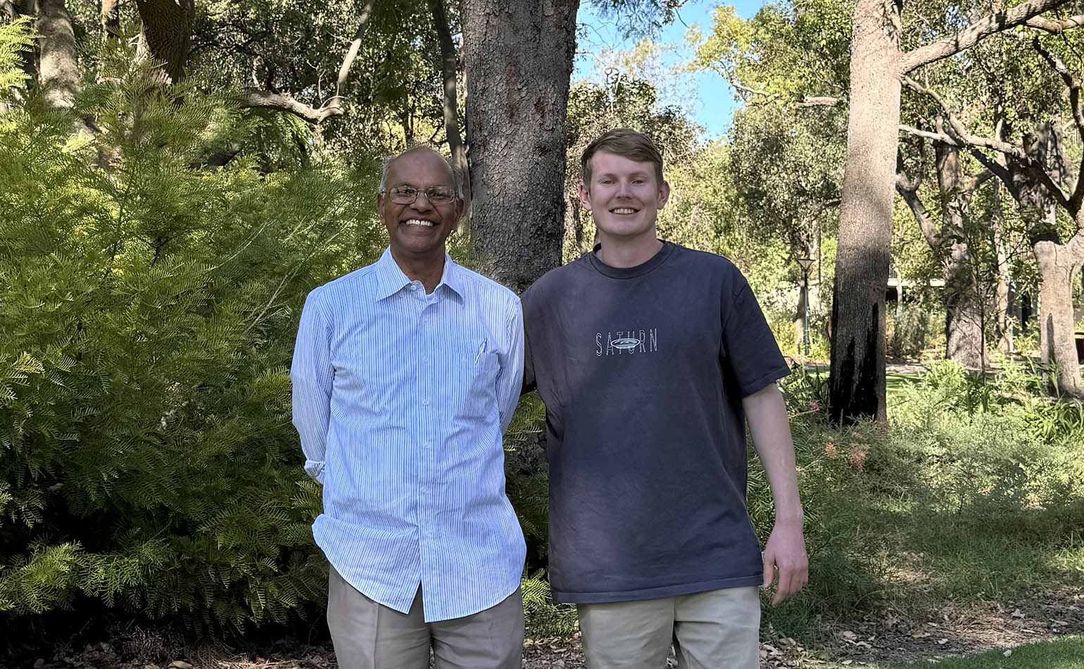 Professor Nanthi Bolan stands beside Soil CRC PhD student James O'Connor