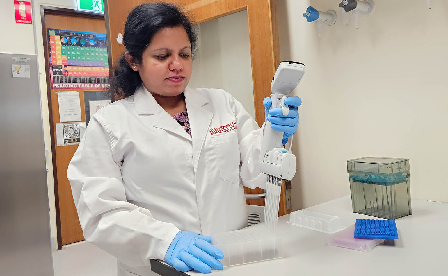 Griffith University researchers working in a lab