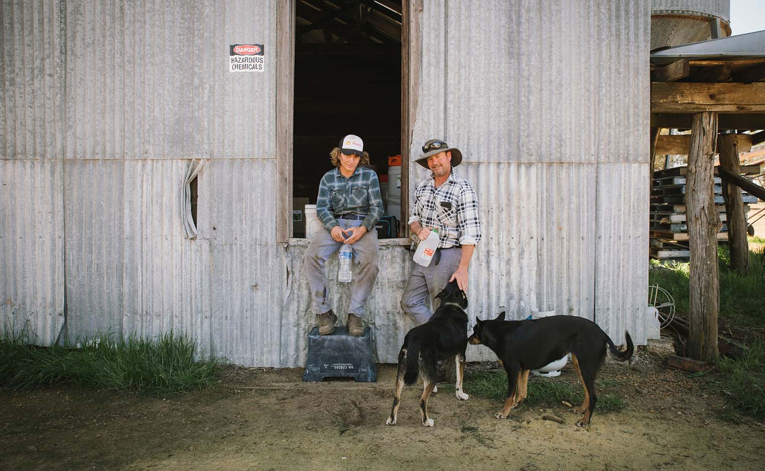 Farmers taking a break from work at the farm shed