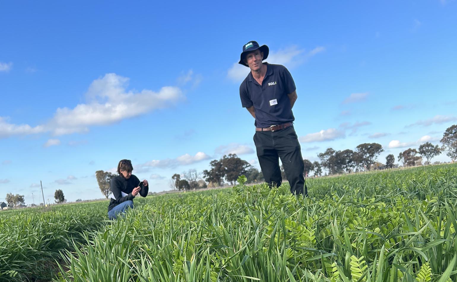 Professor Terry Rose standing in a field in Burramine, Victoria.