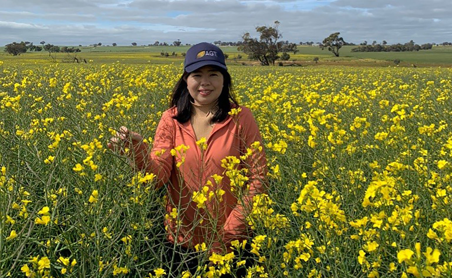 Soil CRC PhD student Win Win Pyone standing in a canola field