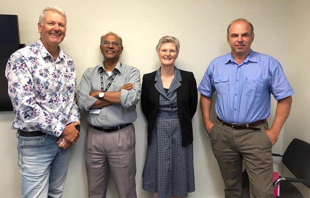 Richard standing next to the three other Program Leaders in 2020.